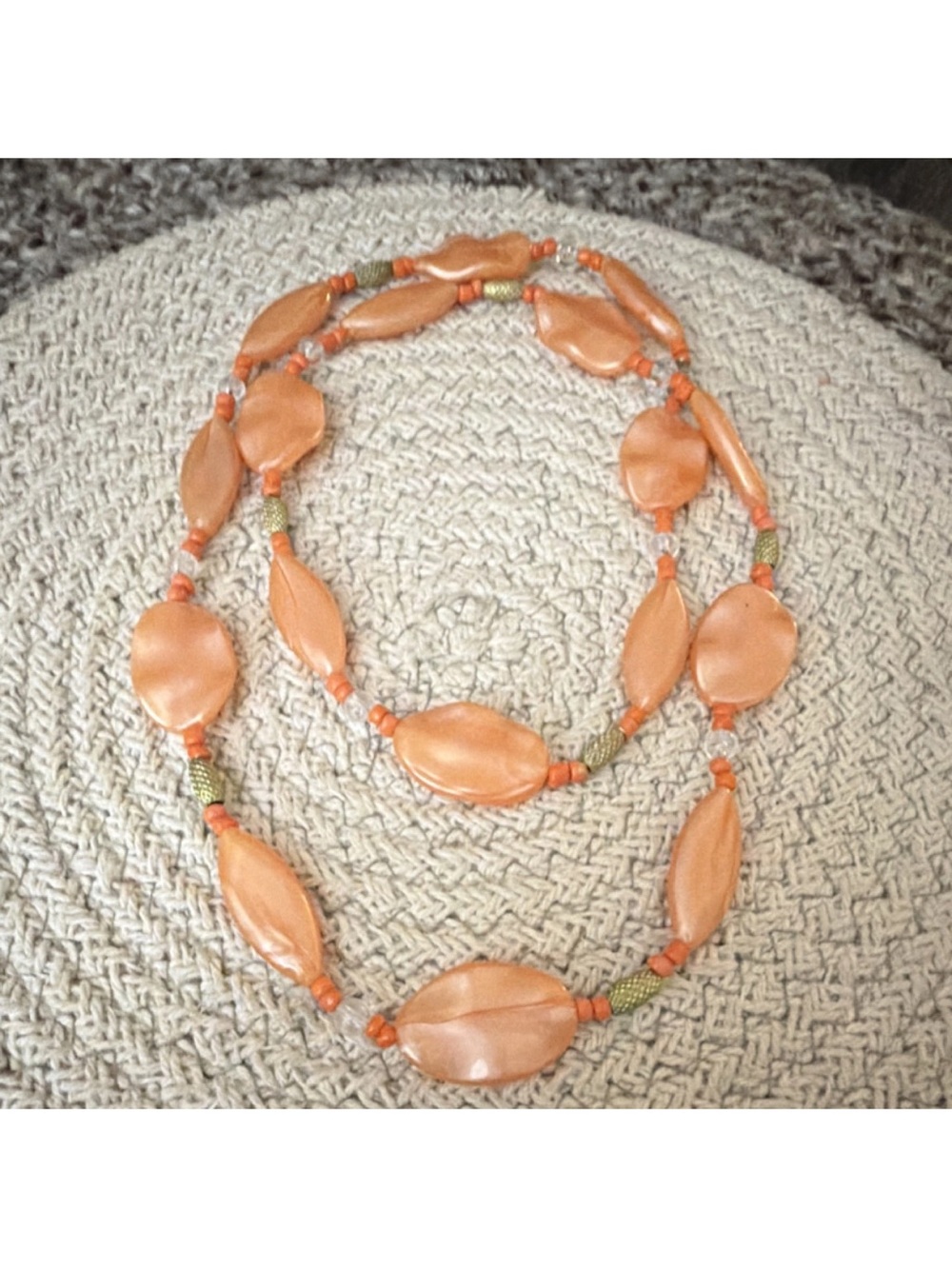 orange plastic beaded necklace with oval beads, no stone, beaded chain